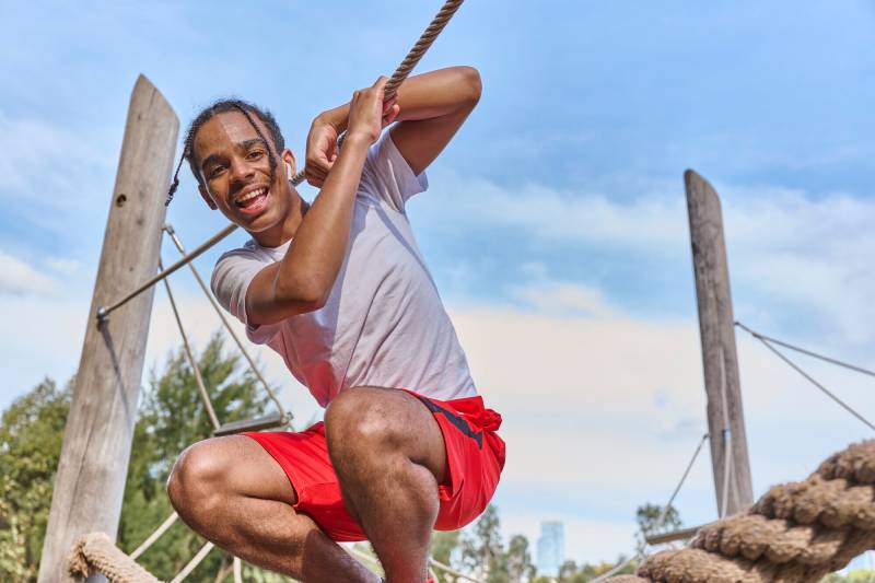teen playing in park
